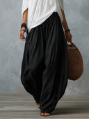 Mara • Conjunto blusa blanca hombros descubiertos y pantalón palazzo negro